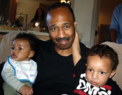 Paul L. Douglass, MD, spending time with his grandchildren, Noah (left) and Aiden.