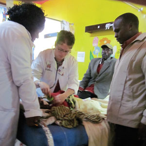 Jodi Skiles, MD, tends to a pediatric cancer patient during a recent trip to Kenya.