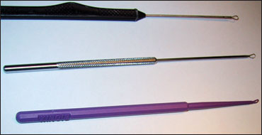 Errumen curettes. Every practitioner who examines pediatric tympanic membranes must be able to effectively use one of these three types of curettes. Many children and more than half of infants up to age 9 months will have cerumen sufficient enough to obscure the visualization of the TMS. Sometimes a Water-Pik is needed to flush out more severe or recalcitrant cerumen. 