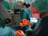 During a DMEK surgery, Gerrit R.J. Melles, MD, PhD, loads the donor Descemet-roll that was pre-dissected in Amnitrans Eyebank into an inserter to  prepare it for injection into the recipient anterior chamber.