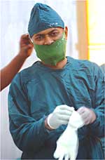 Tatyarao P. Lahane, MBBS, head of the ophthalmology department at J.J. Hospital, prepares for mission at a surgery camp