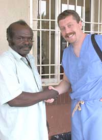 Stan Pletcher, MD shaking hands with his patient Eugenio