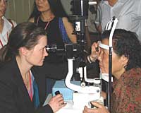 Tammy Yanovich, MD, (U.S. senior resident) examining a Chinese patient