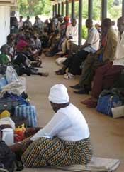 Patients wait their turn at the clinic door 