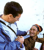 Geoffrey Tabin, MD, co-founder and co-director of the Himalayan Cataract Project, greets a patient.