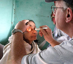 John Arendshorst, MD, examines a patient in Siliguri, India