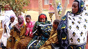 Patients shown outside clinic in Tanzania, waiting for eyecare