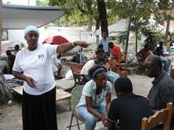 Pediatrician attending to her patients in plaza tent 