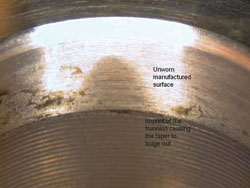 a retrieved taper with a light microscope revealed unworn surfaces and imprint of the trunnion