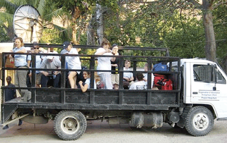 volunteers in back of truck