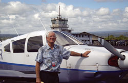 Owens is shown with his Piper Arrow plane