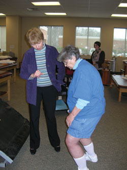 Cheryl Hall, PT, of Physiotherapy Associates works with Operation Joint Implant patient Mary Embly after her total knee replacement.