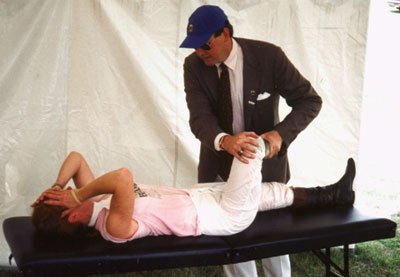 J.W. Thomas Byrd, MD, examines a jockey