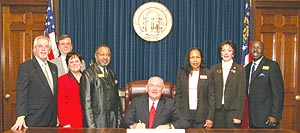 Members of the Opticians of Association of Georgia pose with Gov. Sonny Perdue