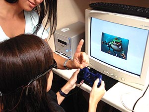 The patient is wearing liquid crystal glasses to separate the right and left views while viewing a stereoscopic picture with four numbers