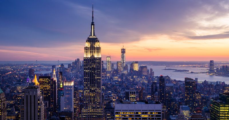 Picture of the Manhattan skyline just before dark with Empire State Building in foreground