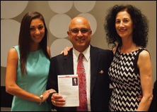 Ajamian at the AOA Distinguished Service Award ceremony with (left) his daughter Natalie and (right) his wife of 28 years, Susan.