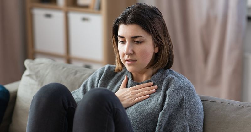 woman having trouble breathing