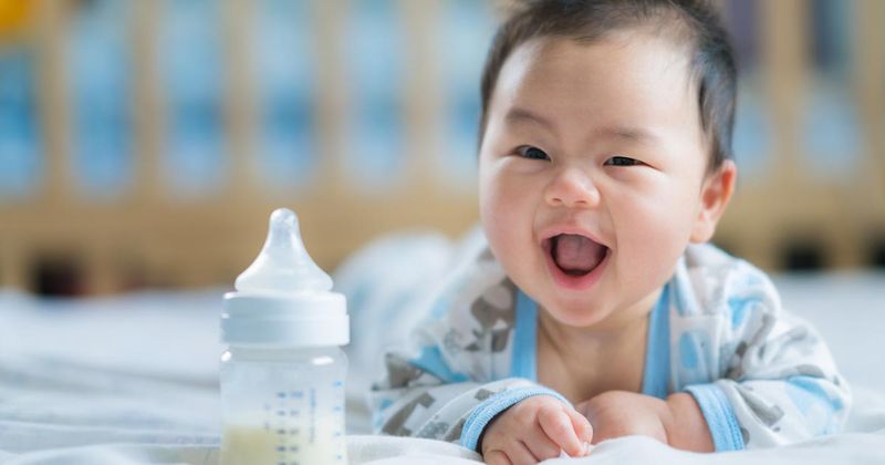 Asian baby with bottle