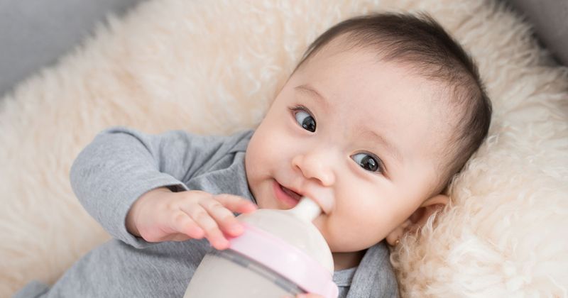 Asian baby with bottle