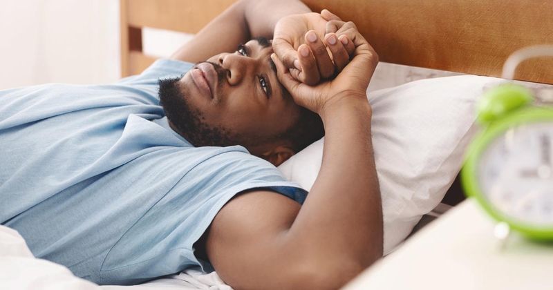 Black man in bed