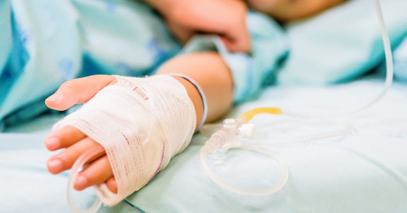 child in a hospital bed