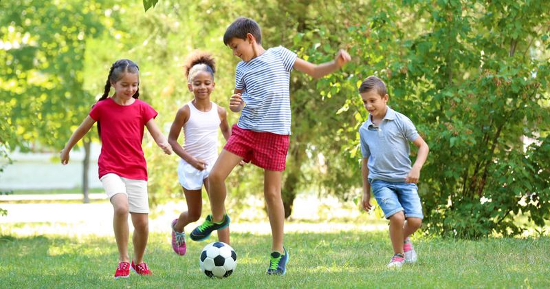 kids playing soccer outside