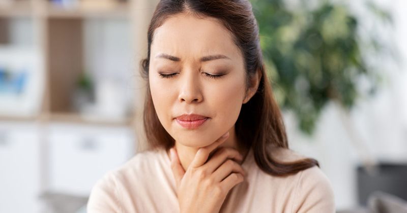 woman with sore throat