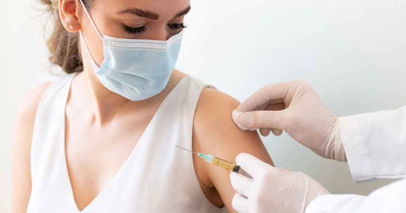 Woman receiving a vaccine