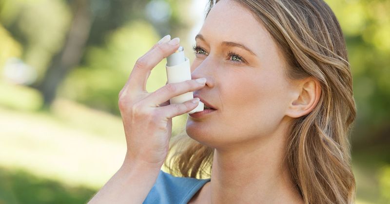 woman with inhaler