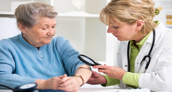 Doctor examines a patient's skin