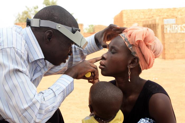 Photo of a woman getting checked for trachoma