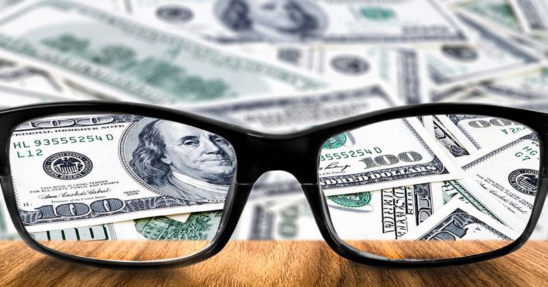 Money behind eyeglasses