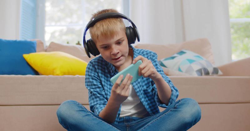 child playing a game on a smartphone