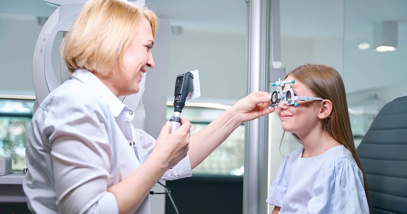 optometrist examining a patient