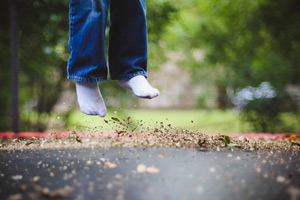 kid jumping on trampoline