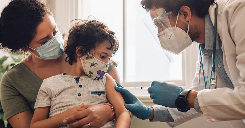 Child getting COVID vaccine