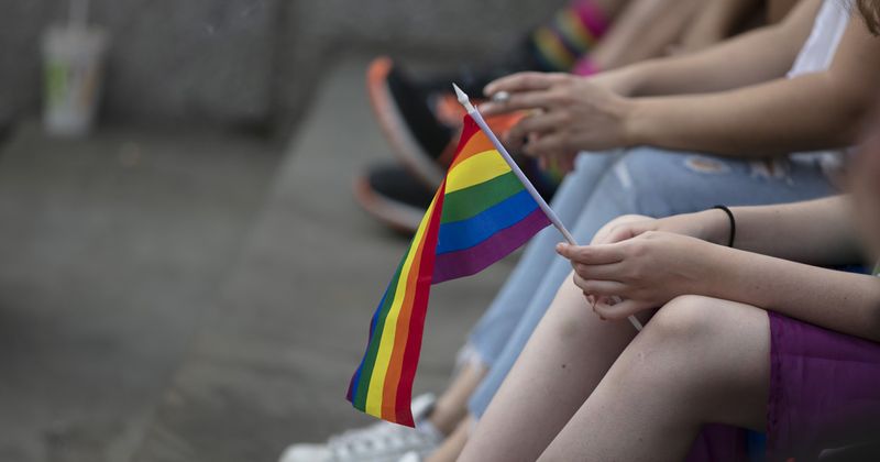 LGTB youths with pride flag