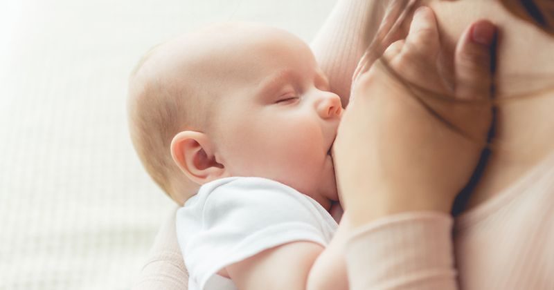 A mother breastfeeding her baby.