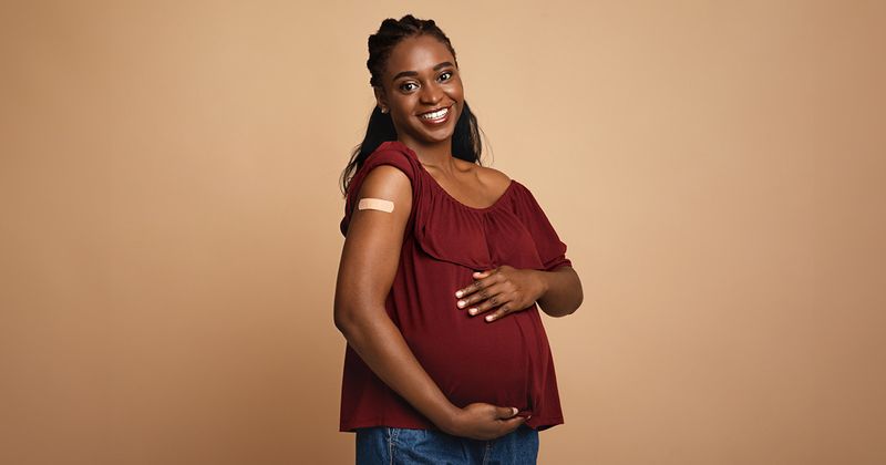 Pregnant Black woman received COVID-19 vaccination.