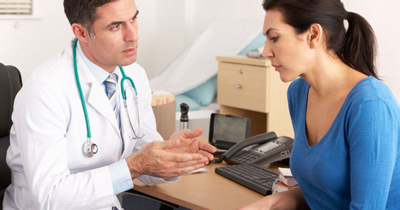 Doctor with female middle age patient