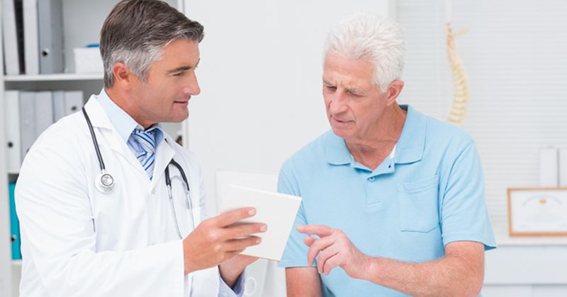 Doctor meets with elderly patient