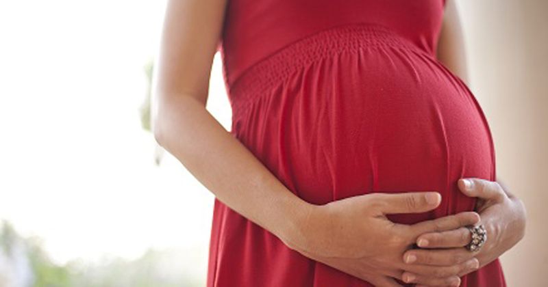 pregant woman holding bump