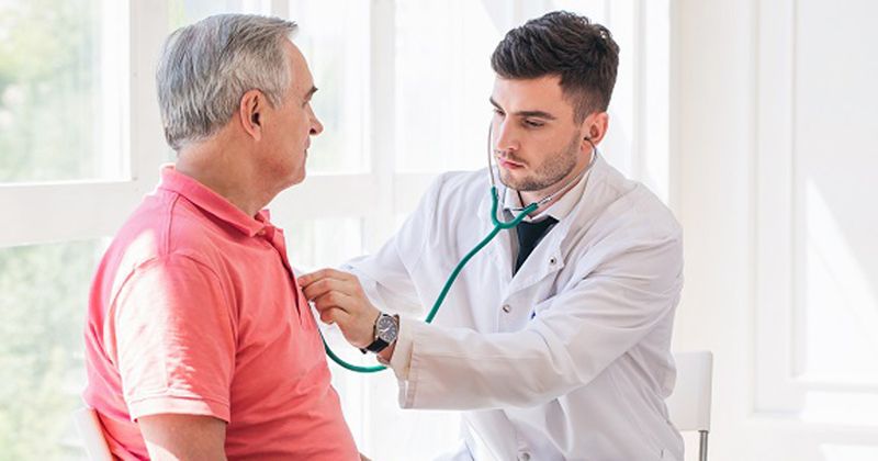 doctor checking patient with a stethascope