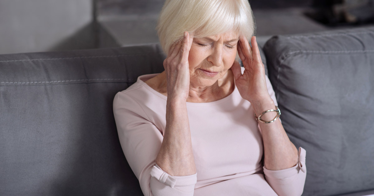 Gray haired woman with headache 2 