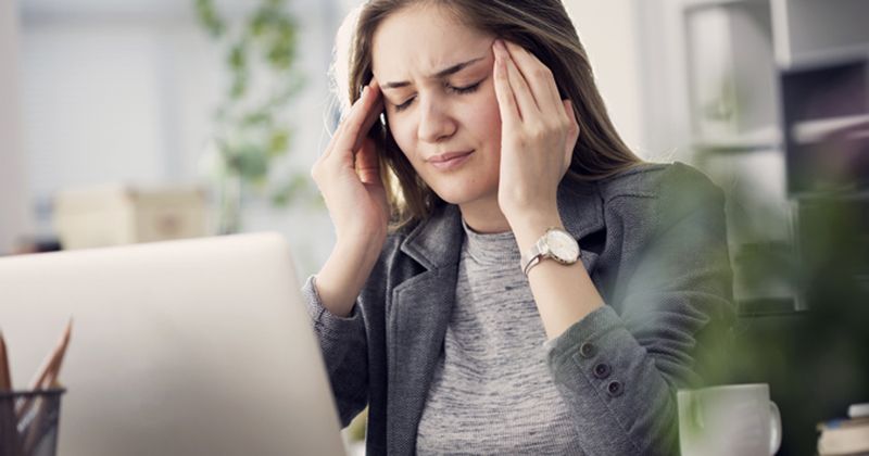 Younger woman with headache