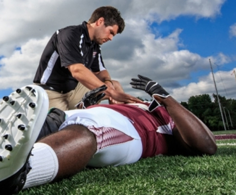 Athlete laying down on field