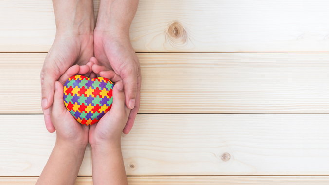 Photo of hands heart autism