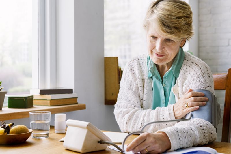 Person Checking Their Own Blood Pressure