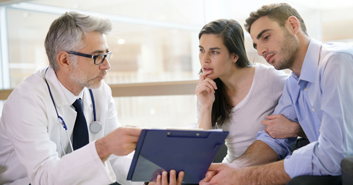 Doctor meeting with couple